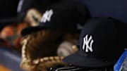 Jun 22, 2018; St. Petersburg, FL, USA; A general view of New York Yankees hat and glove laying in the dugout at Tropicana Field. Mandatory Credit: Kim Klement-Imagn Images