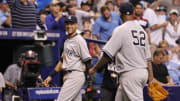 Apr 17, 2014; St. Petersburg, FL, USA; New York Yankees shortstop Derek Jeter (2) smiles with starting pitcher CC Sabathia (52) after they completed a triple play during the second inning against the Tampa Bay Rays at Tropicana Field. Mandatory Credit: Kim Klement-USA TODAY Sports