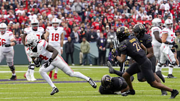 Nov 16, 2024; Chicago, Illinois, USA; Ohio State Buckeyes wide receiver Jeremiah Smith (4) catches a pass against the Northwestern Wildcats during the first half at Wrigley Field. Mandatory Credit: David Banks-Imagn Images