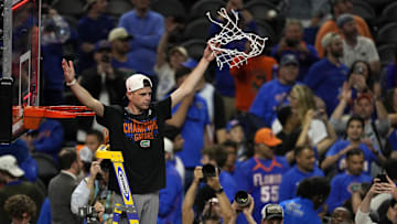 Apr 7, 2025; San Antonio, TX, USA; Florida Gators head coach Todd Golden reacts after cutting the net in the national championship game of the Final Four of the 2025 NCAA Tournament at the Alamodome.Mandatory Credit: Scott Wachter-Imagn Images