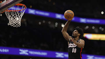 Feb 26, 2025; Washington, District of Columbia, USA; Portland Trail Blazers guard Scoot Henderson (00) dunks the ball against the Washington Wizards in the first half at Capital One Arena. Mandatory Credit: Geoff Burke-Imagn Images