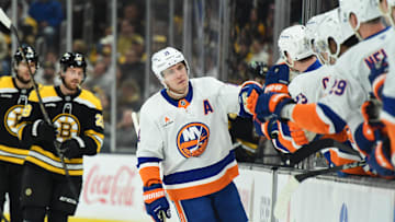 Jan 5, 2025; Boston, Massachusetts, USA; New York Islanders center Bo Horvat (14) is congratulated by his teammates after scoring a goal during the first period against the Boston Bruins at TD Garden. Mandatory Credit: Bob DeChiara-Imagn Images
