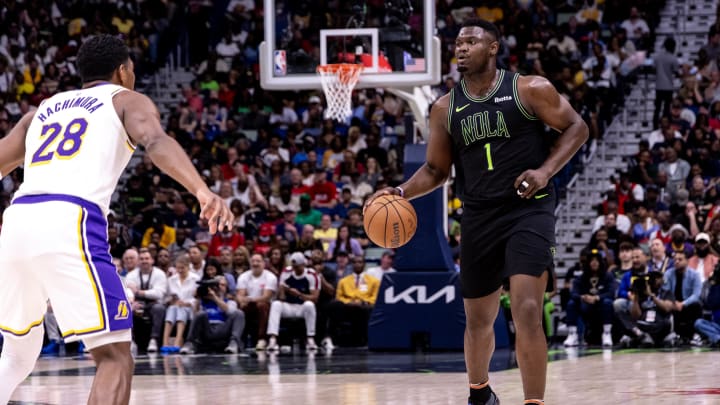 Apr 14, 2024; New Orleans, Louisiana, USA; New Orleans Pelicans forward Zion Williamson (1) dribbles against Los Angeles Lakers forward Rui Hachimura (28) during the first half at Smoothie King Center. Mandatory Credit: Stephen Lew-USA TODAY Sports