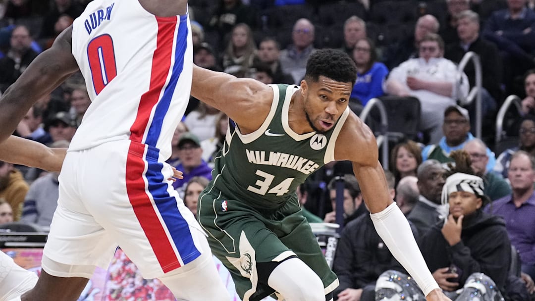 Dec 3, 2025; Milwaukee, Wisconsin, USA; Milwaukee Bucks forward Giannis Antetokounmpo (34) drives to the basket against Detroit Pistons center Jalen Duren (0) in the first half at Fiserv Forum. Mandatory Credit: Michael McLoone-Imagn Images