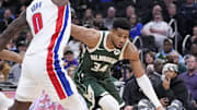 Dec 3, 2025; Milwaukee, Wisconsin, USA; Milwaukee Bucks forward Giannis Antetokounmpo (34) drives to the basket against Detroit Pistons center Jalen Duren (0) in the first half at Fiserv Forum. Mandatory Credit: Michael McLoone-Imagn Images