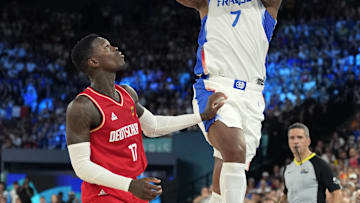 Aug 8, 2024; Paris, France; France power forward Guerschon Yabusele (7) shoots the ball over Germany point guard Dennis Schroder (17) during the second half in a men's basketball semifinal game during the Paris 2024 Olympic Summer Games at Accor Arena. Mandatory Credit: Kyle Terada-USA TODAY Sports