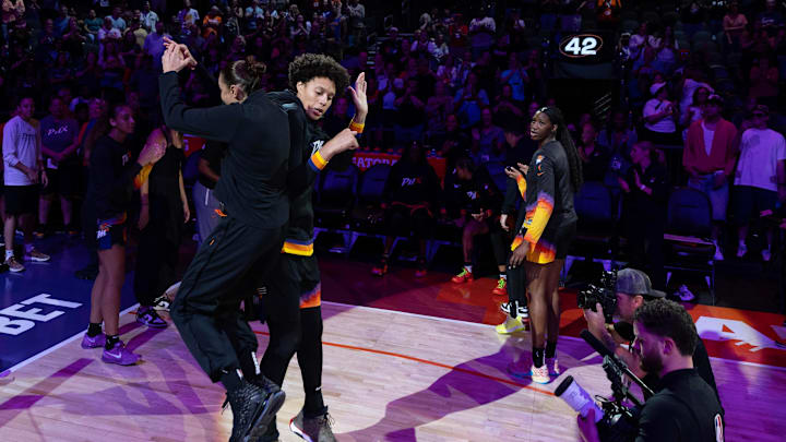 Phoenix Mercury guard Diana Taurasi (3) and Phoenix Mercury center Brittney Griner (42) jump for a side bump before playing the Connecticut Sun on July 1, 2024 at Footprint Center in Phoenix.