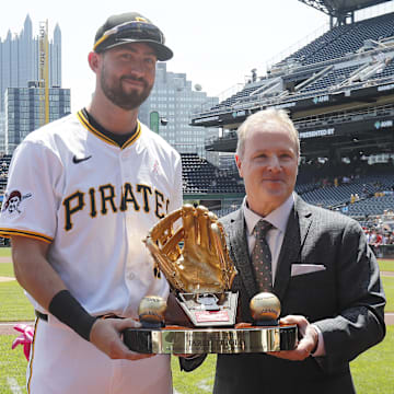 May 11, 2025; Pittsburgh, Pennsylvania, USA;  Pittsburgh Pirates second baseman Jared Triolo (19) receives his 2024 Rawlings Gold Glove Awkward from representative Steve Cohen (right) before the game against the Atlanta Braves at PNC Park. Mandatory Credit: Charles LeClaire-Imagn Images
