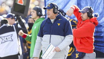 Nov 29, 2025; Morgantown, West Virginia, USA; West Virginia Mountaineers head coach Rich Rodriguez walks along the sidelines during the first quarter against the Texas Tech Red Raiders at Milan Puskar Stadium. Mandatory Credit: Ben Queen-Imagn Images