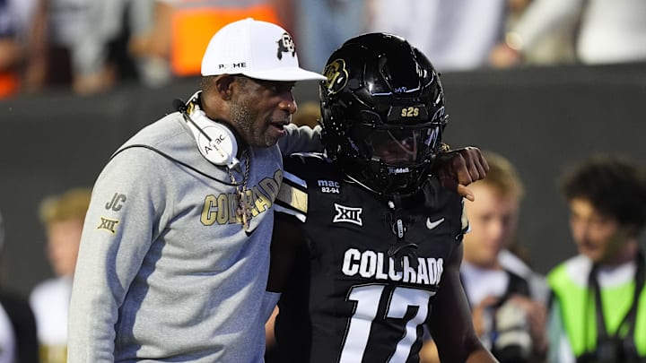 Sep 20, 2025; Boulder, Colorado, USA; Colorado Buffaloes head coach Deion Sanders and wide receiver Isaiah Hardge (17) during the first quarter against the Wyoming Cowboys at Folsom Field. Mandatory Credit: Ron Chenoy-Imagn Images Sep 20, 2025; Boulder, Colorado, USA; Colorado Buffaloes head coach Deion Sanders and wide receiver Isaiah Hardge (17) during the first quarter against the Wyoming Cowboys at Folsom Field. Mandatory Credit: Ron Chenoy-Imagn Images
