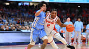Feb 13, 2024; Syracuse, New York, USA; Syracuse Orange guard JJ Starling (2) drives to the basket as North Carolina Tar Heels guard Elliot Cadeau (2) defends during the second half at the JMA Wireless Dome. Mandatory Credit: Rich Barnes-Imagn Images