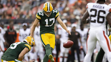 Aug 10, 2024; Cleveland, Ohio, USA; Green Bay Packers kicker Anders Carlson (17) kicks the point after try against the Cleveland Browns during the third quarter at Cleveland Browns Stadium. Mandatory Credit: Scott Galvin-Imagn Images