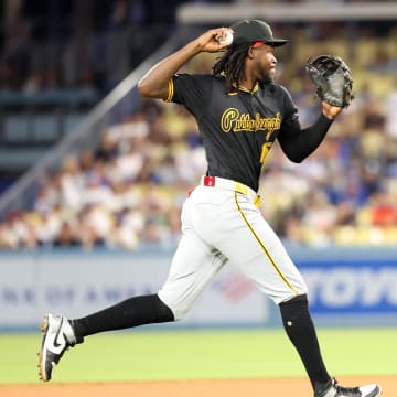 Pittsburgh Pirates shortstop Oneil Cruz (15) fields a ball during the eighth inning against the Los Angeles Dodgers at Dodger Stadium. 