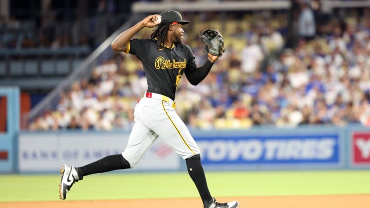 Pittsburgh Pirates shortstop Oneil Cruz (15) fields a ball during the eighth inning against the Los Angeles Dodgers at Dodger Stadium. 