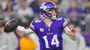 Dec 29, 2024; Minneapolis, Minnesota, USA; Minnesota Vikings quarterback Sam Darnold (14) passes against Green Bay Packers in the second quarter at U.S. Bank Stadium. Mandatory Credit: Brad Rempel-Imagn Images
