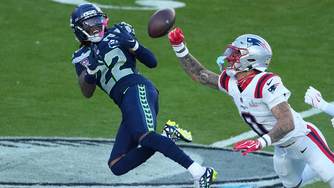 Feb 8, 2026; Santa Clara, CA, USA; New England Patriots cornerback Christian Gonzalez (0) breaks up a pass intended for Seattle Seahawks wide receiver Rashid Shaheed (22) in the first half in Super Bowl LX at Levi's Stadium.