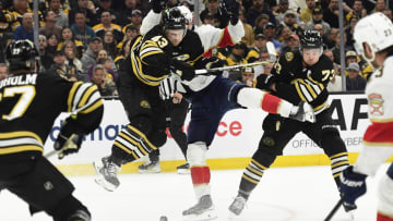 May 17, 2024; Boston, Massachusetts, USA; Boston Bruins center Danton Heinen (43) checks Florida Panthers center Sam Bennett (9) during the second period in game six of the second round of the 2024 Stanley Cup Playoffs at TD Garden. Mandatory Credit: Bob DeChiara-USA TODAY Sports