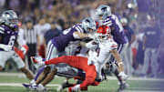 Arizona Wildcats wide receiver Tetairoa McMillan (4) is taken down by Kansas State players during the third quarter of the game at Bill Snyder Family Stadium on Friday, September 13, 2024.