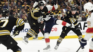 May 17, 2024; Boston, Massachusetts, USA; Boston Bruins center Danton Heinen (43) checks Florida Panthers center Sam Bennett (9) during the second period in game six of the second round of the 2024 Stanley Cup Playoffs at TD Garden. Mandatory Credit: Bob DeChiara-Imagn Images