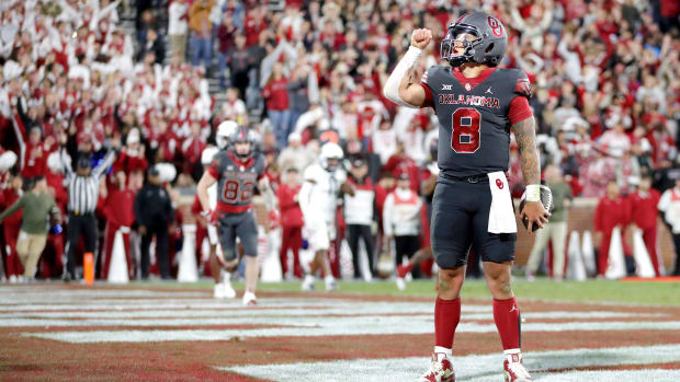 Oklahoma's Dillon Gabriel (8) reacts after scoring a touchdown in the second half of a college football game between the Univ