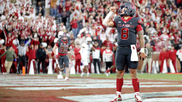 Oklahoma's Dillon Gabriel reacts after scoring a touchdown in the second half against the West Virginia Mountaineers.