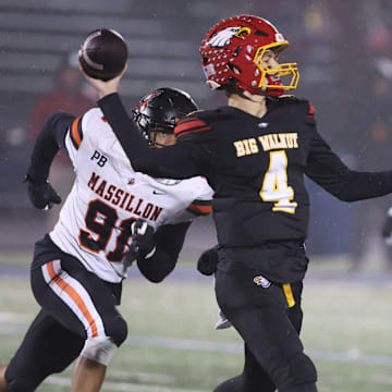 Big Walnut QB throws a pass against Massillon in an OHSAA Division II regional championship, Friday, Nov. 21, 2025, in Zanesville.