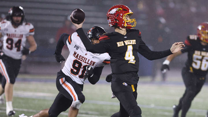 Big Walnut QB throws a pass against Massillon in an OHSAA Division II regional championship, Friday, Nov. 21, 2025, in Zanesville. Big Walnut QB throws a pass against Massillon in an OHSAA Division II regional championship, Friday, Nov. 21, 2025, in Zanesville.