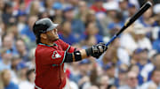 Apr 18, 2025; Chicago, Illinois, USA; Arizona Diamondbacks third baseman Eugenio Suarez (28) hits a grand slam against the Chicago Cubs during the eight inning at Wrigley Field.