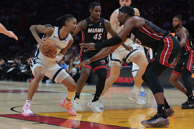 Memphis Grizzlies guard Ja Morant (12) drives to the basket against Miami Heat center Bam Adebayo