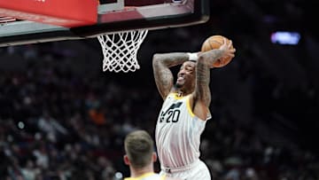 Dec 6, 2024; Portland, Oregon, USA; Utah Jazz power forward John Collins (20) goes up for a dunk against the Portland Trail Blazers during the second half at Moda Center. Mandatory Credit: Soobum Im-Imagn Images