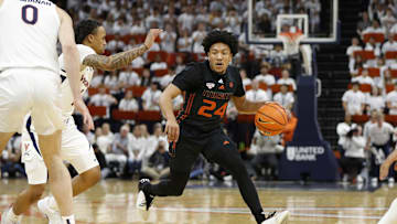 Feb 5, 2024; Charlottesville, Virginia, USA; Miami (Fl) Hurricanes guard Nijel Pack (24) dribbles the ball as Virginia Cavaliers guard Dante Harris (1) defends during the first half at John Paul Jones Arena. Mandatory Credit: Amber Searls-Imagn Images