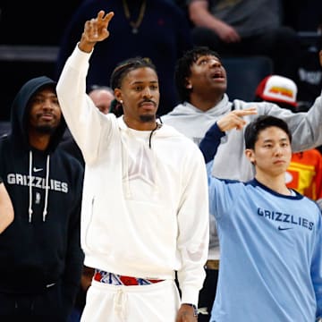 Nov 20, 2024; Memphis, Tennessee, USA; Memphis Grizzlies guard Cam Spencer (24), guard Marcus Smart (36), guard Ja Morant (12), forward GG Jackson II (45) and  guard Yuki Kawamura (17) react from the bench during the second half against the  Philadelphia 76ers  at FedExForum. Mandatory Credit: Petre Thomas-Imagn Images
