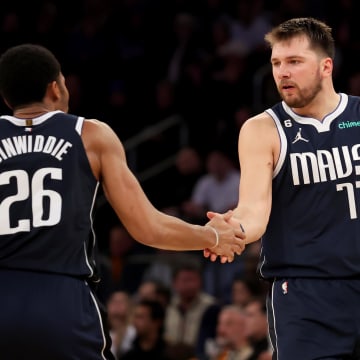 Dec 3, 2022; New York, New York, USA; Dallas Mavericks guard Luka Doncic (77) celebrates with guard Spencer Dinwiddie (26) during the third quarter against the New York Knicks at Madison Square Garden. Mandatory Credit: Brad Penner-USA TODAY Sports