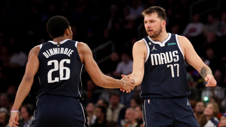 Dec 3, 2022; New York, New York, USA; Dallas Mavericks guard Luka Doncic (77) celebrates with guard Spencer Dinwiddie (26) during the third quarter against the New York Knicks at Madison Square Garden. Mandatory Credit: Brad Penner-USA TODAY Sports