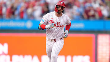 Philadelphia Phillies infielder Bryce Harper rounds the bases after hitting a home run against the Boston Red Sox.