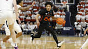 Feb 5, 2024; Charlottesville, Virginia, USA; Miami (Fl) Hurricanes guard Nijel Pack (24) dribbles the ball as Virginia Cavaliers guard Dante Harris (1) defends during the first half at John Paul Jones Arena. Mandatory Credit: Amber Searls-Imagn Images