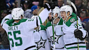 Jan 7, 2025; New York, New York, USA;  Dallas Stars left wing Jason Robertson (21) and Dallas Stars defenseman Thomas Harley (55) celebrate the game winning goal against the New York Rangers by Dallas Stars left wing Jamie Benn (14) during the overtime period at Madison Square Garden. Mandatory Credit: Dennis Schneidler-Imagn Images