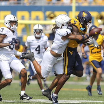 Penn State safety Jaylen Reed (1) breaks up a pass intended for West Virginia receiver Traylon Ray. 