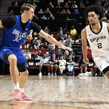 Jul 12, 2025; Las Vegas, NV, USA; Dallas Mavericks forward Cooper Flagg (32) defends against San Antonio Spurs guard Dylan Harper (2) in the second quarter of their game at Thomas & Mack Center.
