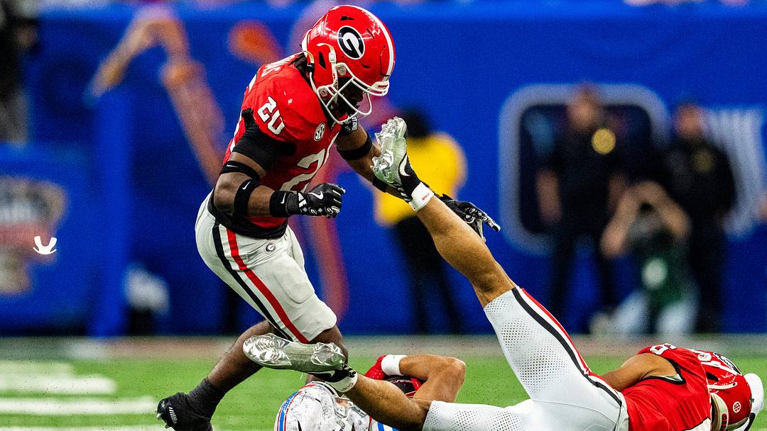 A mouthguard flies through the air after Georgia defensive back JaCorey Thomas (20) hits Ole Miss wide receiver Cayden Lee (19) to the ground during the Sugar Bowl and College Football Playoff quarterfinals at Caesars Superdome in New Orleans, La., on Thursday, Jan. 1, 2026. Ole Miss defeated Georgia 39-34. Thomas was called for targeting and ejected from the game.