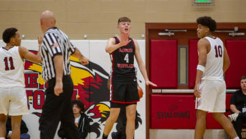 Nikolas Khamenia (4) tells his coach he is fine to stay in the game at the Hoophall West final Chaparral High School gym the Chaparral High School gym on Dec. 2, 2023.