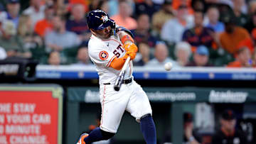Apr 30, 2025; Houston, Texas, USA; Houston Astros designated hitter Jose Altuve (27) hits an RBI double against the Detroit Tigers during the fifth inning at Daikin Park. 