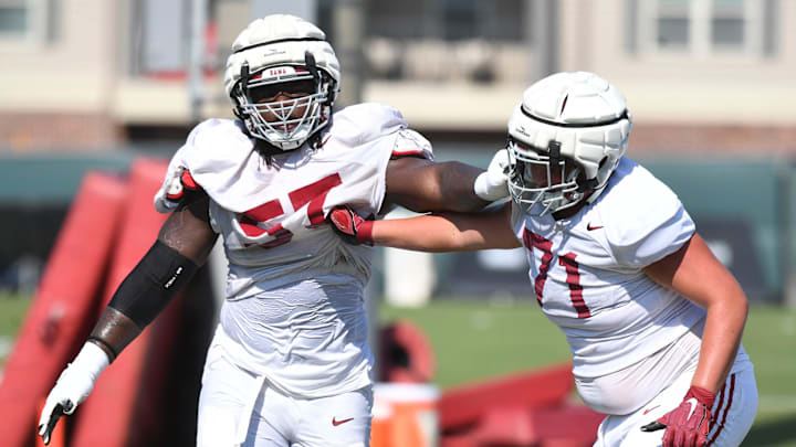 The Crimson Tide players and coaches continue working toward the season opener in practice Tuesday, Aug. 13, 2024. Alabama offensive lineman Elijah Pritchett (57) blocks Alabama offensive lineman Jackson Howell (71).