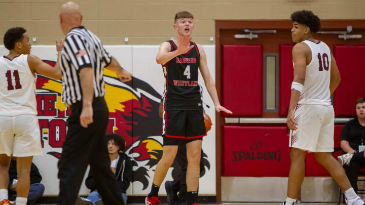 Nikolas Khamenia (4) tells his coach he is fine to stay in the game at the Hoophall West final Chaparral High School gym the Chaparral High School gym on Dec. 2, 2023.