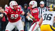 Nebraska quarterback TJ Lateef, protected by Henry Lutovsky, throws pass in third quarter vs. Iowa. 