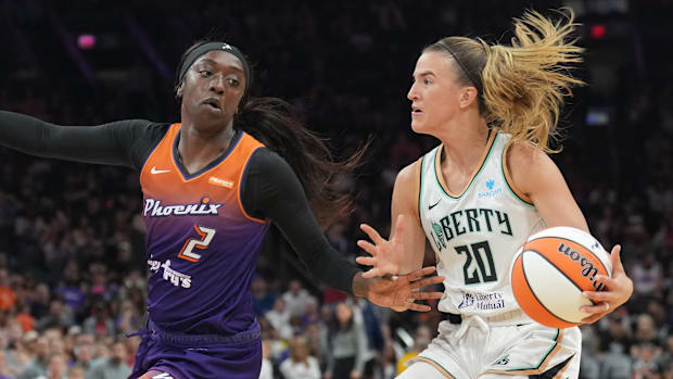 A photo of Kahleah Copper defending Sabrina Ionescu