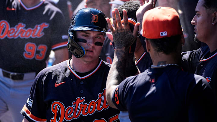 Detroit Tigers infielder Kevin McGonigle high-fives shortstop Javier Báez in the dugout after scoring a run against New York Yankees during the first inning at George M. Steinbrenner Field in Tampa, Fla. on Saturday, Feb. 21, 2026.