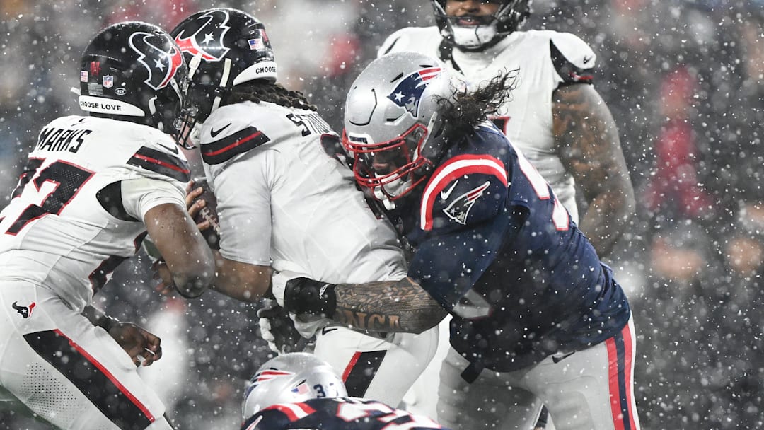 Jan 18, 2026; Foxborough, MA, USA; New England Patriots defensive lineman Khyiris Tonga (95) sacks Houston Texans quarterback C.J. Stroud (7) in the fourth quarter in an AFC Divisional Round game at Gillette Stadium. Mandatory Credit: Brian Fluharty-Imagn Images