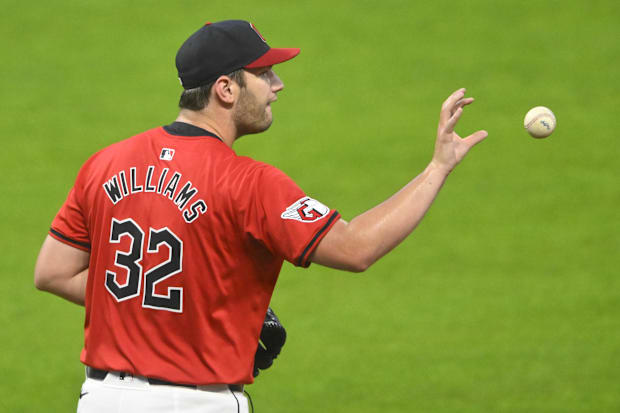 Gavin Williams catches a ball thrown back to him 