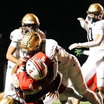 Elizabethtown High School linebacker  tackles John Hardin High School running back 